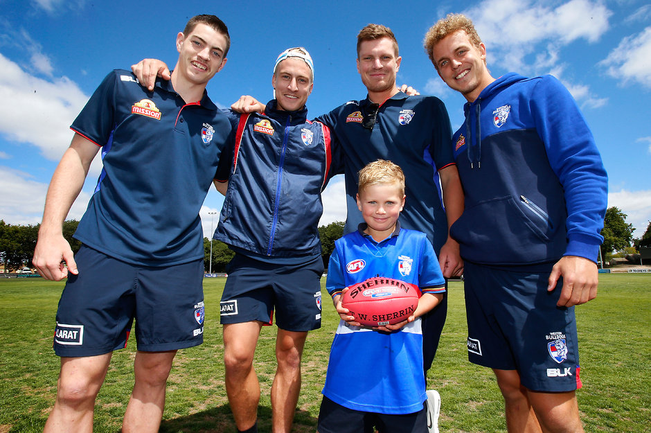 AFL 2016 Media - Western Bulldogs Community Camp BALLARAT, AUSTRALIA - FEBRUARY 16: (L-R) Brad Lynch, Shane Biggs, Jack Redpath and Mitch Wallis of the Bulldogs pose for a photograph during the Western Bulldogs Community Camp clinic for Pleasant Street Primary School students at the City Oval in Ballarat, Australia on February 16, 2016. (Photo by Adam Trafford/AFL Media)